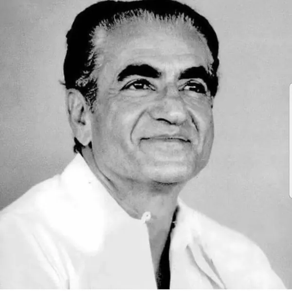 His Majesty, the Shah of Iran with dark hair and a white collared shirt looks slightly upward and to the side — a public domain photograph from The Shah of Iran archive documenting the Pahlavi era.